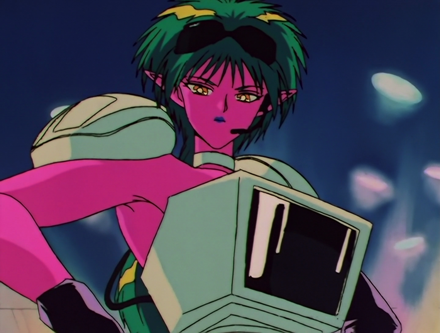 U-Pasokon, a Daimon from Sailor Moon episode 120. She has bright pink skin and green spiky hair. Her outfit is made out of 1995 computer parts: her top is a white CRT monitor and she wears white mice on her shoulders. She also has black goggles that she isn’t currently wearing, and an earpiece with an attached microphone.